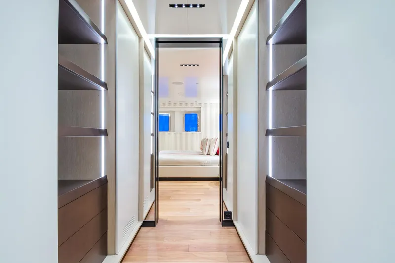 Rio Yacht Photos Pics Luxurious CRN 62m yacht interior hallway with modern shelving, leading to a bedroom, 2022 model.