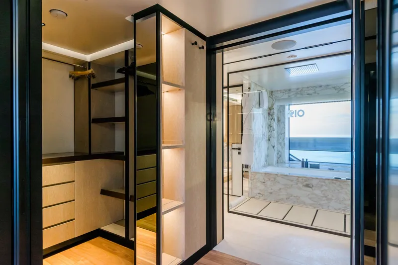 Rio Yacht Photos Pics Luxurious CRN 62m yacht interior with modern closet and ocean-view bathroom, 2022 model.