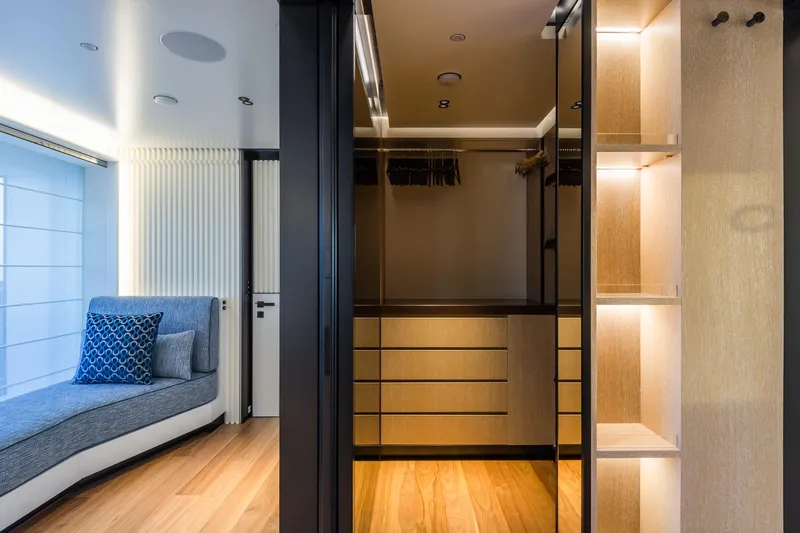 Rio Yacht Photos Pics Luxurious interior of 2022 CRN 62m yacht featuring modern closet and seating area.