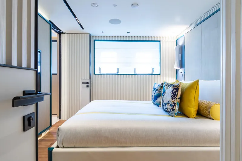 Rio Yacht Photos Pics Luxurious CRN 62m yacht bedroom, 2022 model, featuring modern design and vibrant pillows.
