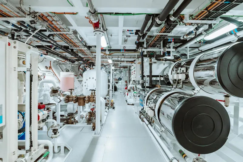 Rio Yacht Photos Pics Engine room of 2022 CRN 62m yacht, featuring complex machinery and piping systems.
