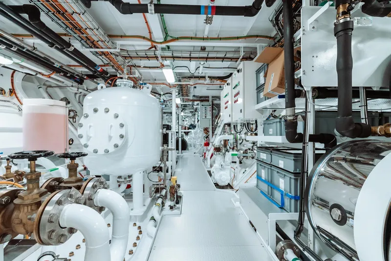 Rio Yacht Photos Pics Engine room of a 2022 CRN 62m yacht, featuring complex piping and machinery.