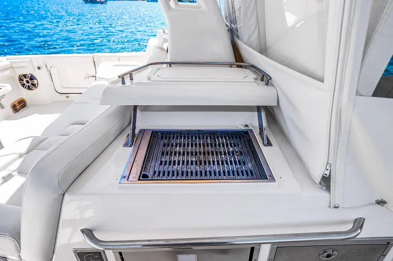  Yacht Photos Pics Luxury grill station on 2025 Grady-White Canyon 456 boat, ocean backdrop.