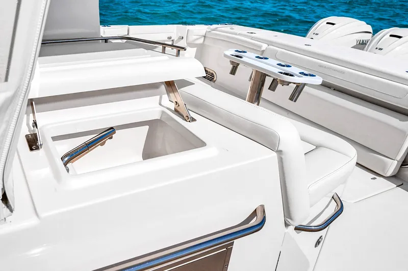  Yacht Photos Pics 2025 Grady-White Canyon 456 boat interior with fishing rod holders and storage compartment.