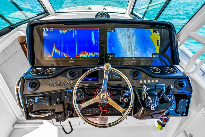  Yacht Photos Pics Helm of 2025 Grady-White Canyon 456 with advanced navigation displays and controls.