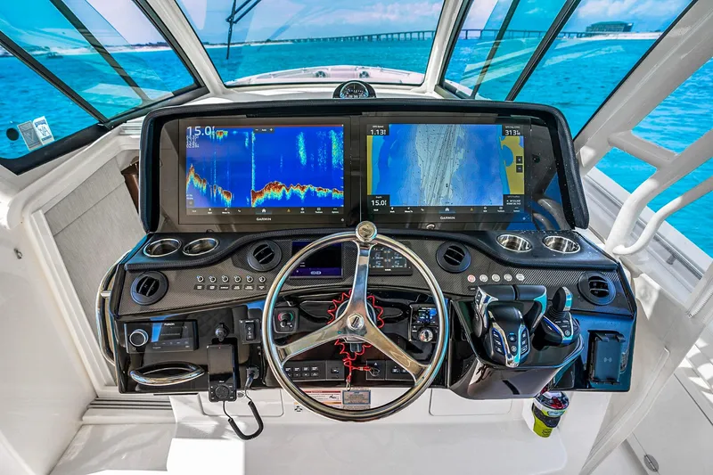  Yacht Photos Pics Helm of 2025 Grady-White Canyon 456 with advanced navigation displays and controls.