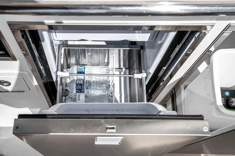  Yacht Photos Pics Built-in cooler with water bottles on Grady-White Canyon 456, 2025 model.
