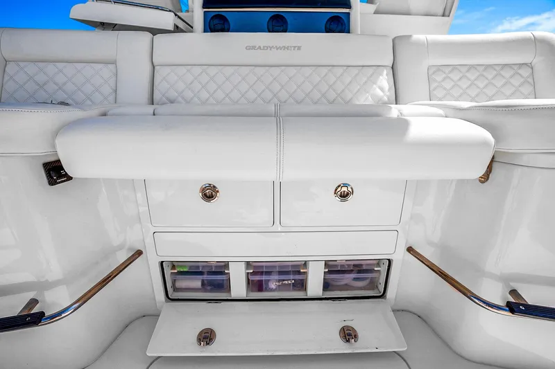  Yacht Photos Pics 2025 Grady-White Canyon 456 boat interior with white seating and storage compartments.