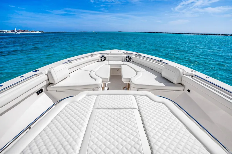  Yacht Photos Pics Luxurious 2025 Grady-White Canyon 456 boat interior with plush seating on open water.