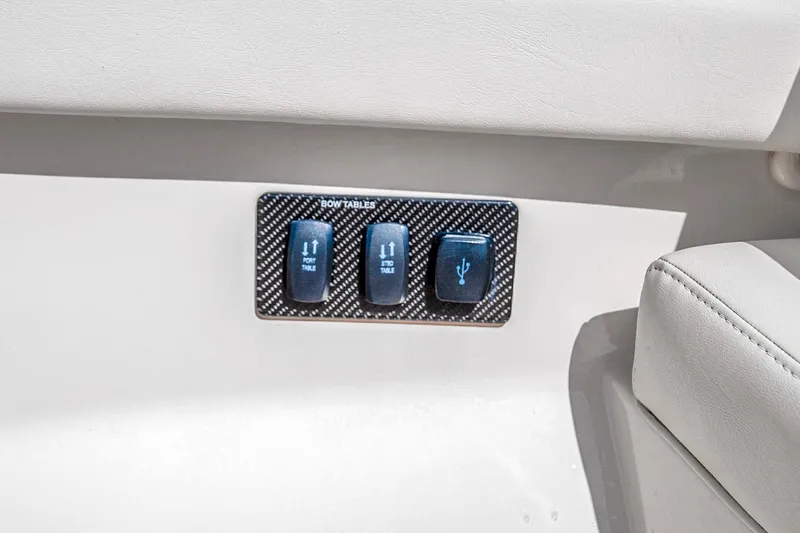  Yacht Photos Pics Control panel on 2025 Grady-White Canyon 456 boat with table and USB switches.