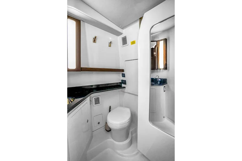  Yacht Photos Pics Luxurious bathroom in 2025 Grady-White Canyon 456 boat, featuring modern fixtures and sleek design.