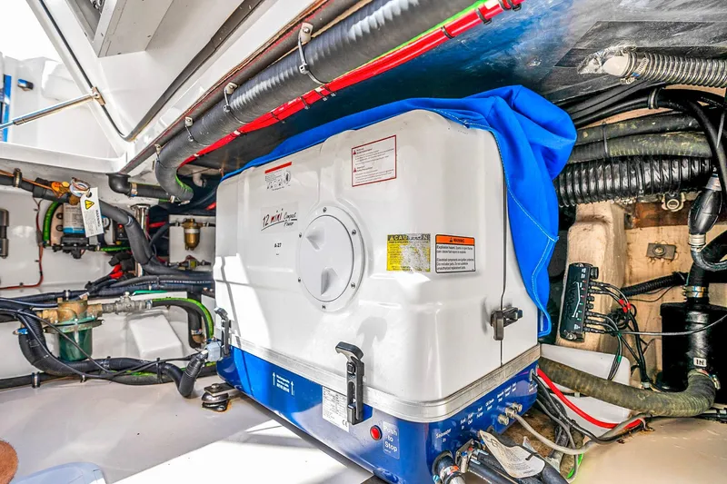  Yacht Photos Pics Engine room of 2025 Grady-White Canyon 456 boat, showcasing mechanical components and wiring.