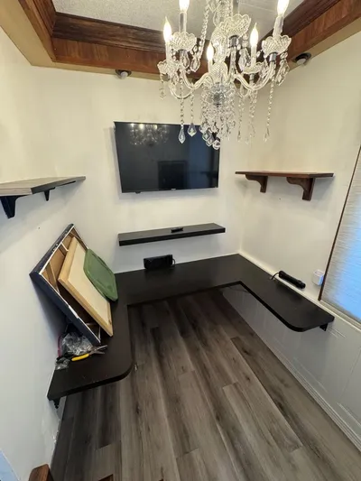  Yacht Photos Pics Luxurious 1986 Stardust Cruisers houseboat interior with chandelier, TV, and elegant shelving.