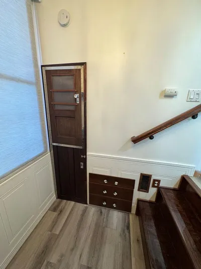  Yacht Photos Pics 1986 Stardust Cruisers houseboat interior with wooden stairs and small door.