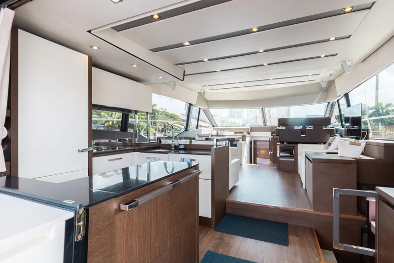 Knightlife Yacht Photos Pics Luxurious interior of 2017 Prestige 630 yacht with modern kitchen and seating area.