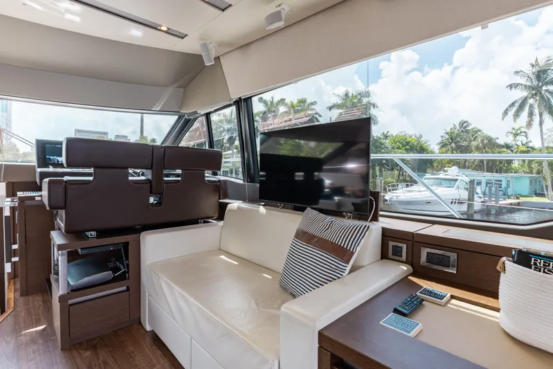 Knightlife Yacht Photos Pics Luxurious interior of 2017 Prestige 630 yacht with modern seating and large windows.