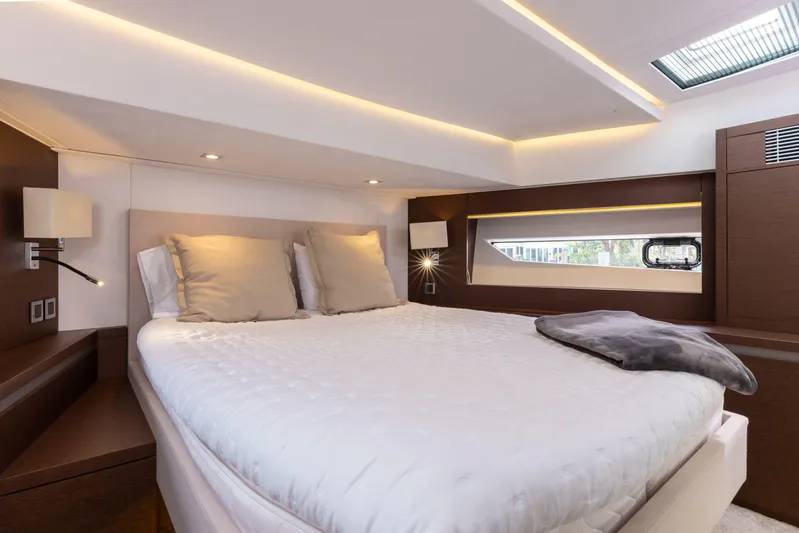 Knightlife Yacht Photos Pics Luxurious bedroom interior of 2017 Prestige 630 yacht with modern lighting and cozy bedding.