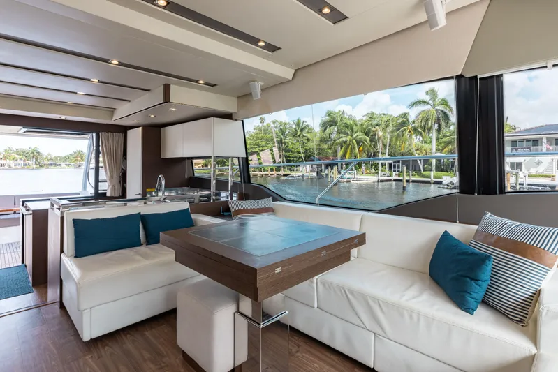 Knightlife Yacht Photos Pics Luxurious interior of 2017 Prestige 630 yacht with white seating and large windows.