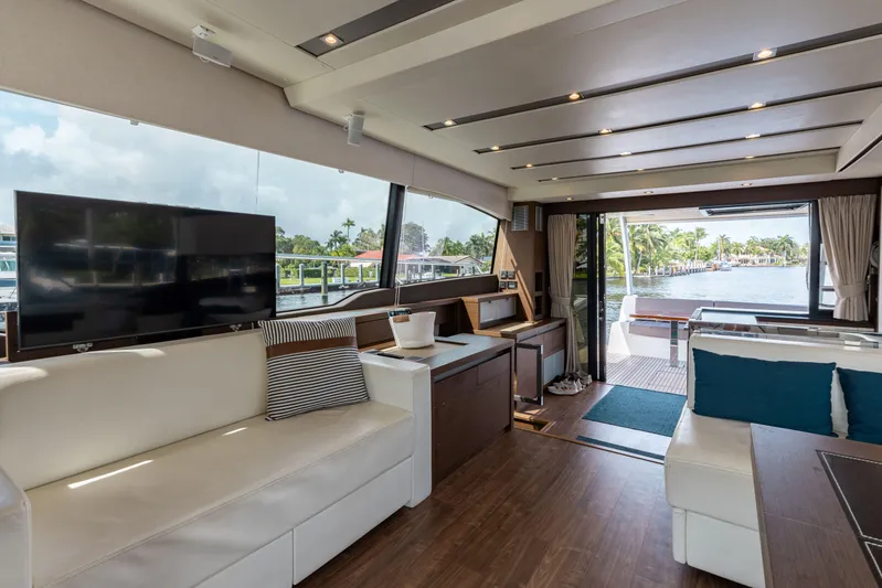 Knightlife Yacht Photos Pics Luxurious interior of 2017 Prestige 630 yacht with modern furnishings and large windows.