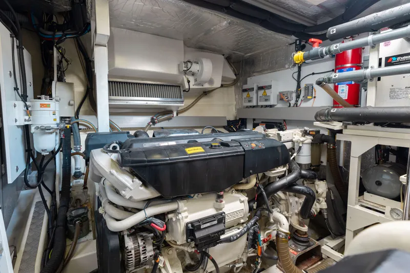 Knightlife Yacht Photos Pics Engine room of a 2017 Prestige 630 yacht, showcasing machinery and equipment.