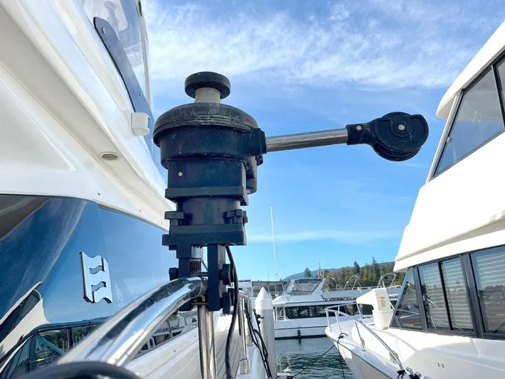  Yacht Photos Pics Close-up of a 2018 Ferretti Yachts 550 deck detail with marina background.