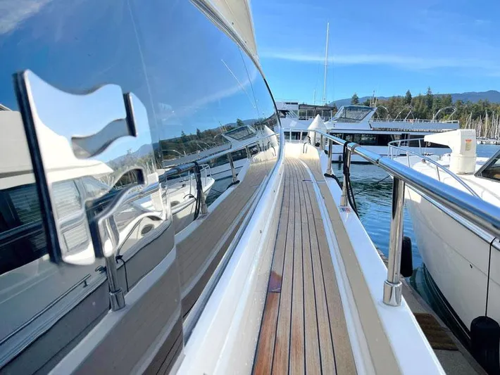  Yacht Photos Pics 2018 Ferretti Yachts 550, sleek deck view, docked in a marina.