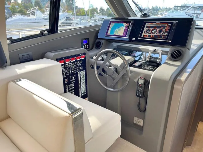  Yacht Photos Pics Cockpit of 2018 Ferretti Yachts 550 with modern navigation and control systems.