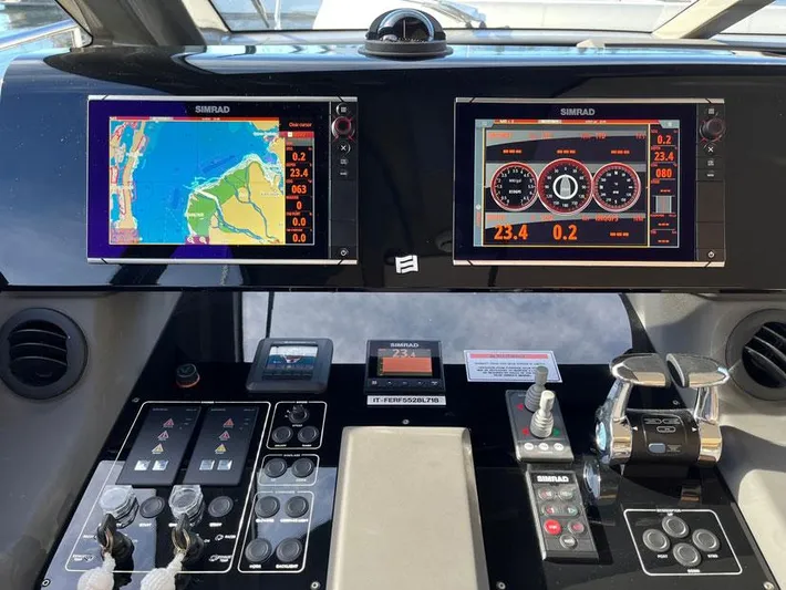  Yacht Photos Pics Control panel of a 2018 Ferretti Yachts 550 with navigation and engine displays.