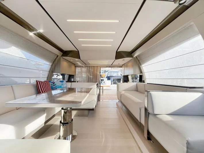  Yacht Photos Pics Luxurious interior of 2018 Ferretti Yachts 550 with modern seating and elegant design.