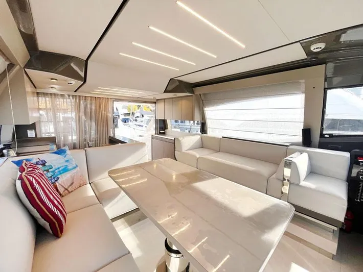  Yacht Photos Pics Luxurious interior of 2018 Ferretti Yachts 550 with modern seating and elegant design.