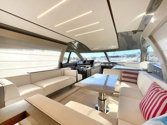  Yacht Photos Pics Luxurious interior of 2018 Ferretti Yachts 550 with modern seating and sleek design.