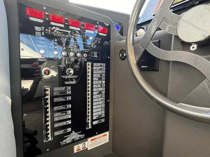  Yacht Photos Pics Control panel of a 2018 Ferretti Yachts 550, featuring gauges and switches.