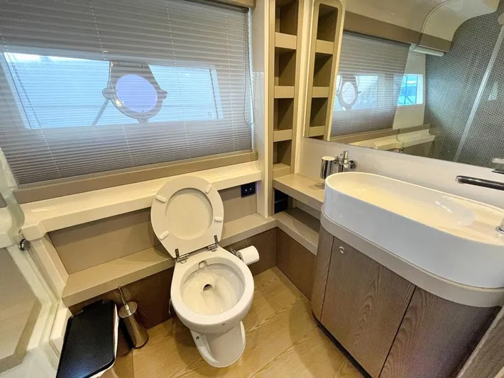  Yacht Photos Pics Luxurious bathroom in 2018 Ferretti Yachts 550, featuring modern fixtures and elegant design.