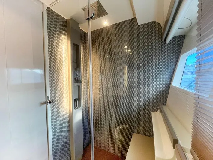  Yacht Photos Pics Luxurious bathroom interior of 2018 Ferretti Yachts 550 with modern shower design.
