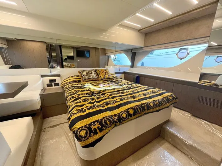  Yacht Photos Pics Luxurious bedroom interior of 2018 Ferretti Yachts 550 with elegant bedding and modern design.