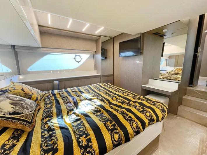  Yacht Photos Pics Luxurious bedroom interior of 2018 Ferretti Yachts 550 with elegant bedding and modern design.