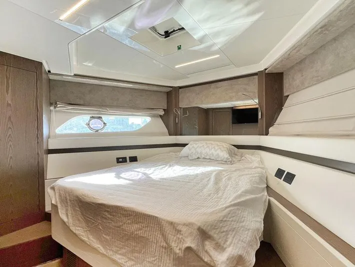  Yacht Photos Pics Luxurious bedroom interior of 2018 Ferretti Yachts 550 with modern design and natural light.