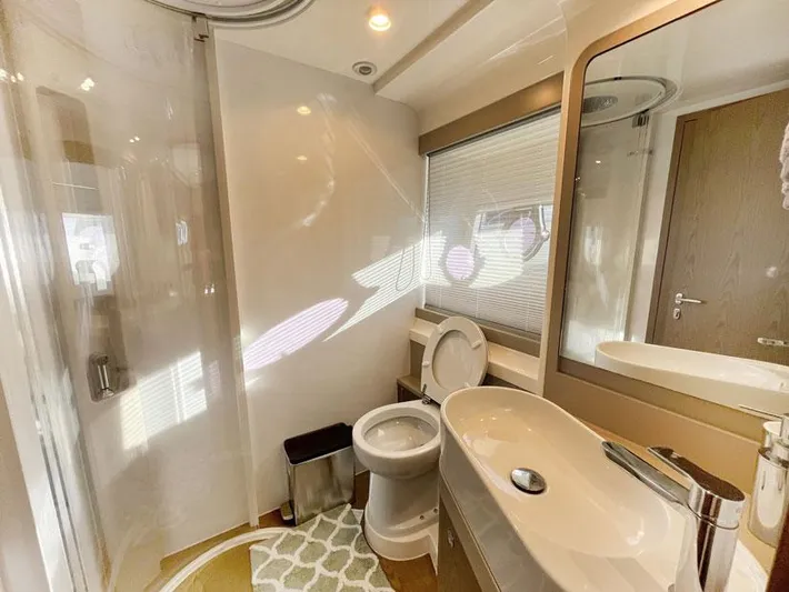  Yacht Photos Pics Luxurious bathroom in 2018 Ferretti Yachts 550, featuring modern fixtures and elegant design.