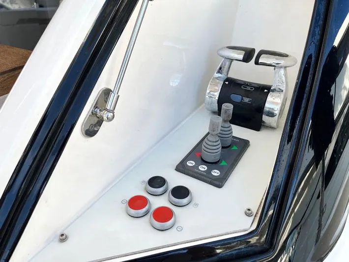  Yacht Photos Pics Control panel of a 2018 Ferretti Yachts 550, featuring buttons and throttle levers.