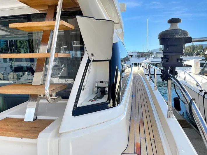  Yacht Photos Pics 2018 Ferretti Yachts 550, sleek deck view with wooden stairs and modern design.