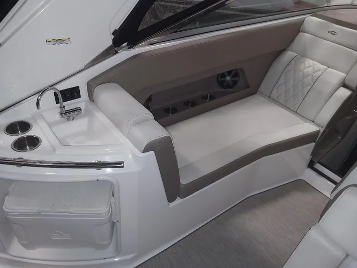 Northern Exposure II Yacht Photos Pics 2018 Regal 28 Express boat interior with seating, sink, and cup holders.