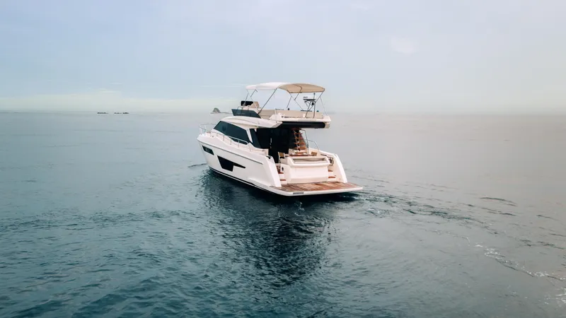  Yacht Photos Pics 2022 Ferretti Yachts 500 cruising on calm ocean waters.