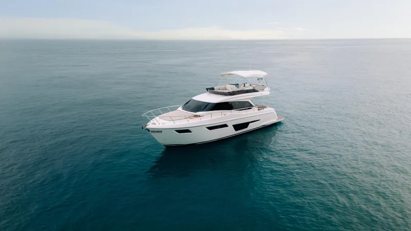  Yacht Photos Pics 2022 Ferretti Yachts 500 cruising on open sea under clear sky.