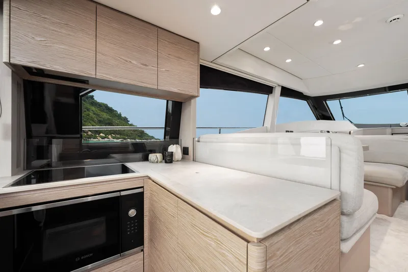  Yacht Photos Pics Luxurious interior of 2022 Ferretti Yachts 500 with modern kitchen and scenic views.
