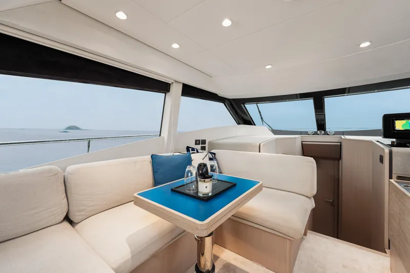  Yacht Photos Pics Luxurious interior of 2022 Ferretti Yachts 500 with elegant seating and ocean view.