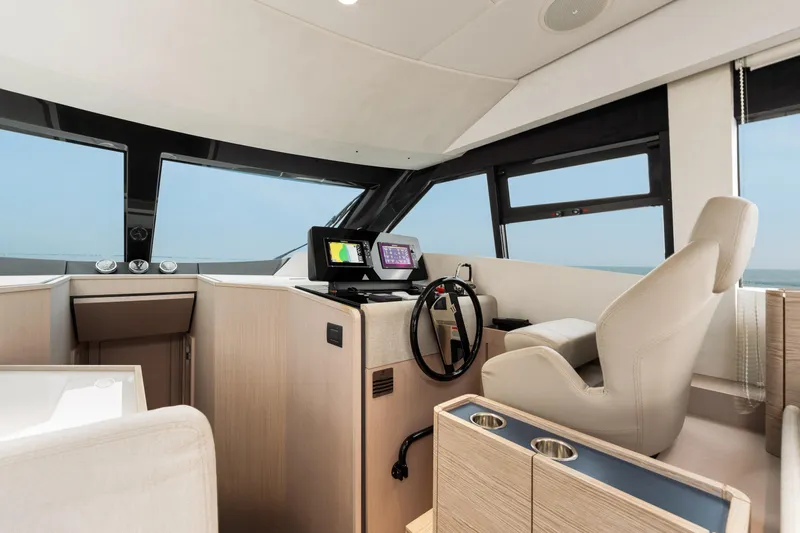  Yacht Photos Pics Luxurious interior of 2022 Ferretti Yachts 500, featuring modern helm and navigation systems.