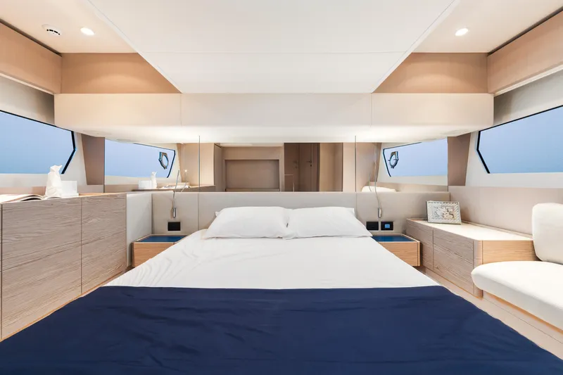  Yacht Photos Pics Luxurious bedroom interior of 2022 Ferretti Yachts 500 with modern design and ocean view.