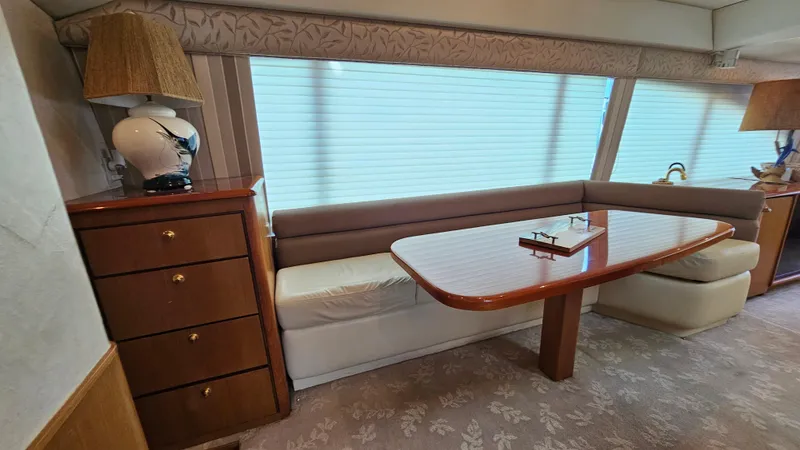  Yacht Photos Pics Interior of 2000 Ocean Yachts 70 Super Sport with elegant dining area and wooden cabinetry.