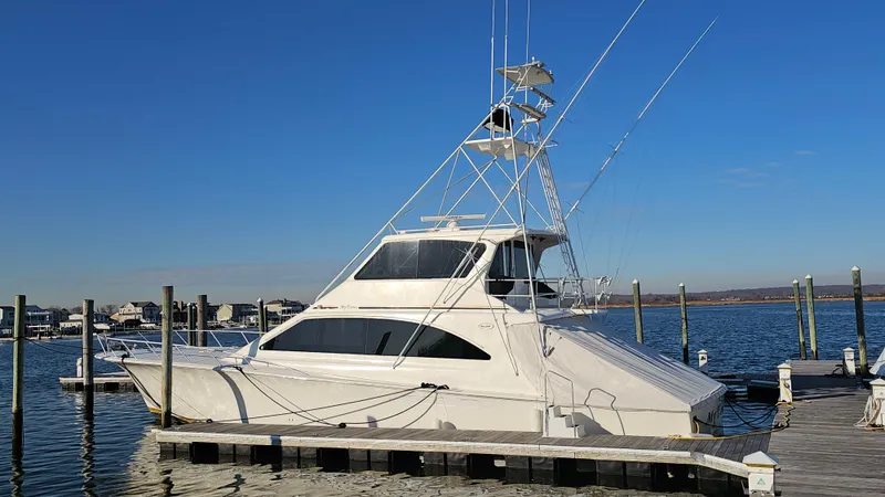  Yacht Photos Pics 2000 Ocean Yachts 70 Super Sport docked at a marina under clear blue skies.