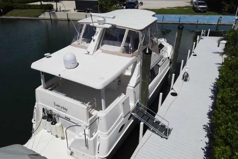 Everyday Yacht Photos Pics 2003 Silverton 453 Motor Yacht docked at a marina, viewed from above.